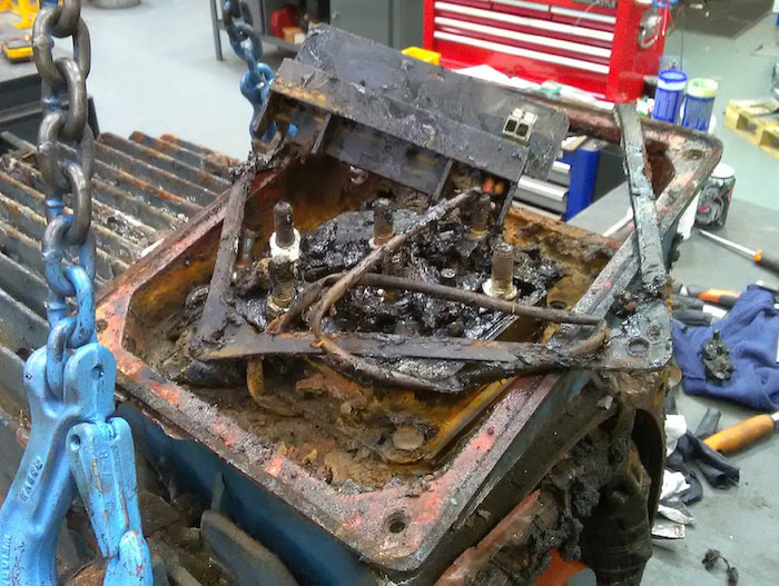 The rusted control box in the motor